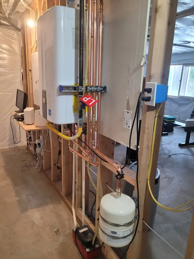 Licensed plumber repairing a kitchen sink in Green Acres